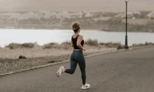 a woman running on a road